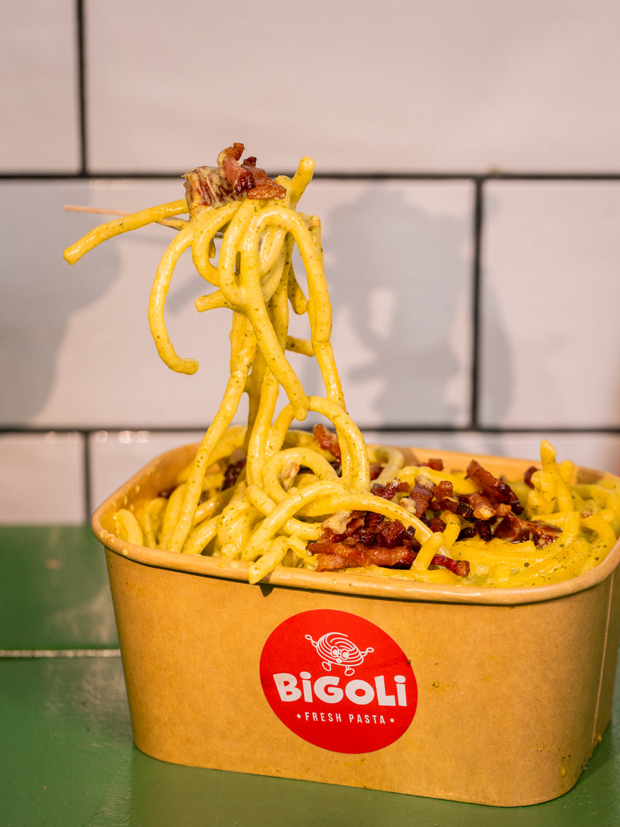 Bigoli carbonara with pancetta in a Bigoli takeaway box