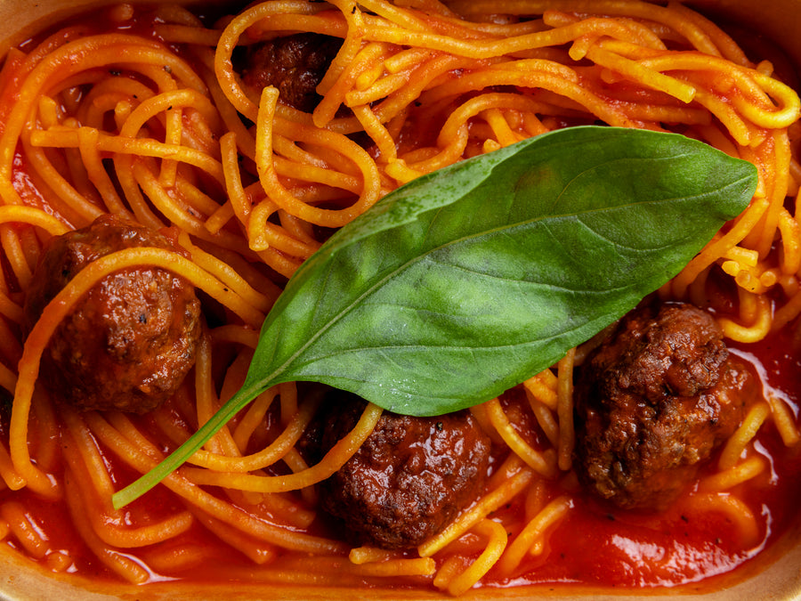 Spaghetti and meatballs in tomato sauce with fresh basil at Bigoli